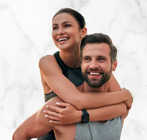 Young and in-shape couple smiling | Sculpt Your Vision